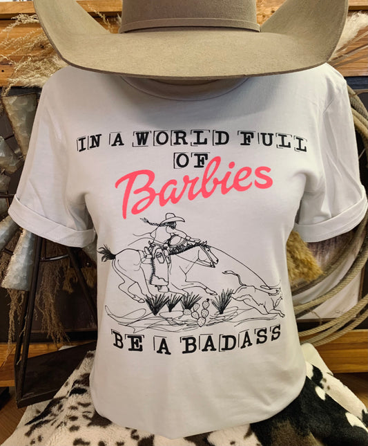In A World Full of Barbies Be A Badass Tee