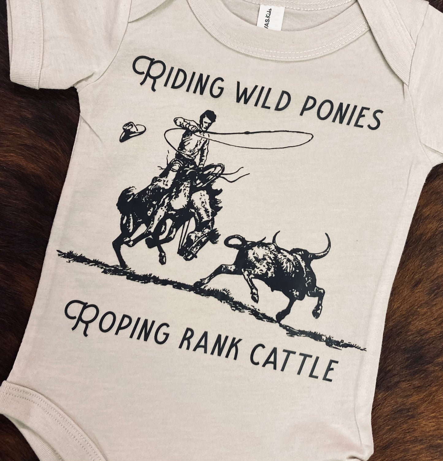 “Wild Ponies & Rank Cattle” Western Onesie